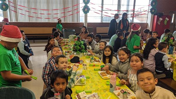 Students dress up and get served a fine meal. 